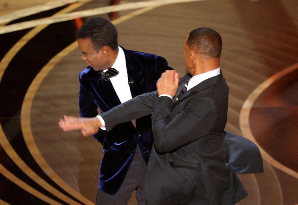 Will Smith hits Chris Rock at the 2022 Oscars ceremony (REUTERS)