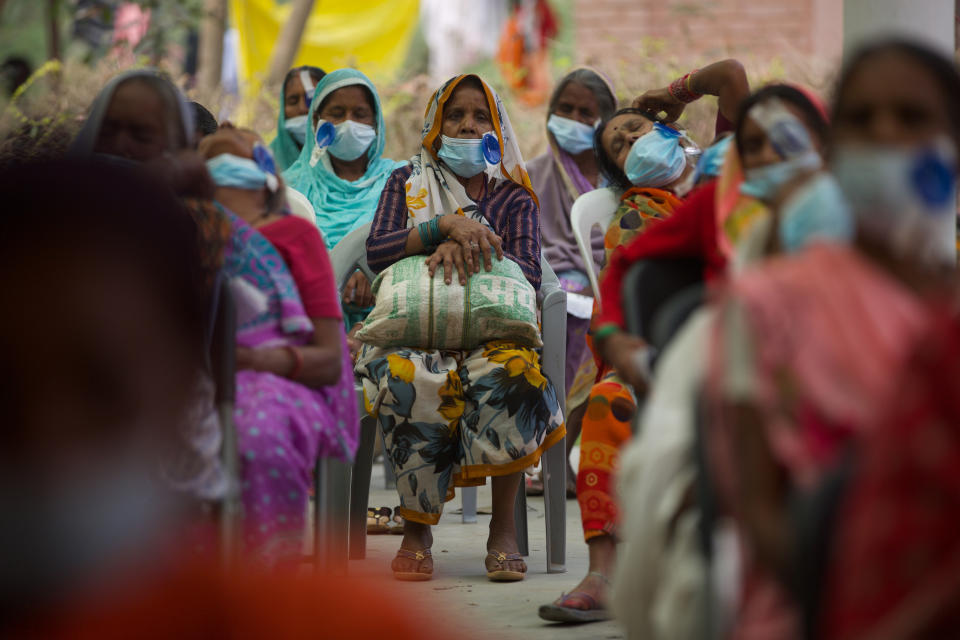 Nepalese patients wait for their follow up after cataract surgery with Dr. Sanduk Ruit at an eye camp in Lumbini, 288 kilometers (180 miles) south west of Kathmandu, Nepal, March 31, 2021. Nepal’s “God of Sight” eye doctor renowned for his innovative and inexpensive cataract surgery for the poor is taking his work beyond the Himalayan mountains to other parts of the world so there is no more unnecessary blindness in the world. Ruit, who has won many awards for his work and performed some 130,000 cataract surgery in the past three decades, is aiming to expand his work beyond the borders of his home country and the region to go globally. (AP Photo/Bikram Rai)