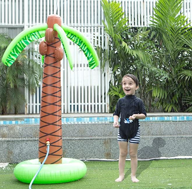 Bring the beach to your backyard. Find this inflatable palm tree yard sprinkler for $30 on <a href="https://amzn.to/2BoJq9P" target="_blank" rel="noopener noreferrer">Amazon</a>.