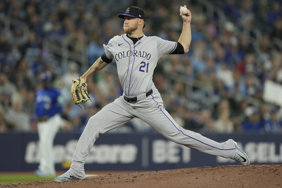 Colorado Rockies pitcher Kyle Freeland throws against the Toronto Blue Jays during second-inning baseball game action in Toronto, Sunday, April 14, 2024. (Frank Gunn/The Canadian Press via AP)