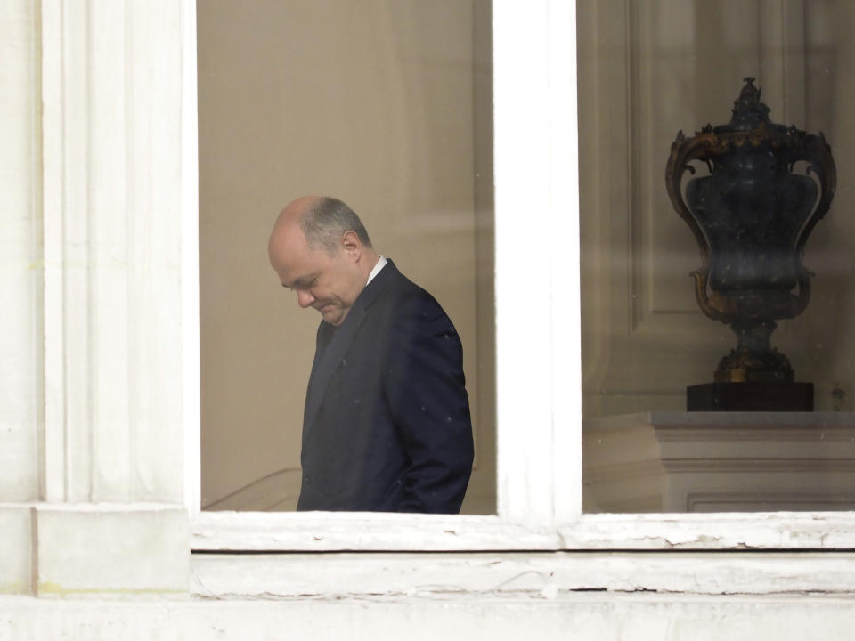 Outgoing French Interior Minister Bruno Le Roux arrives to welcome his successor Matthias Fekl, prior to a handover ceremony, in Paris, Wednesday, March 22, 2017. Le Roux resigned Tuesday a few hours after prosecutors opened an investigation into a report that he hired his two daughters for a series of temporary parliamentary jobs, starting when they were 15 and 16 years old. (AP Photo/Thibault Camus)