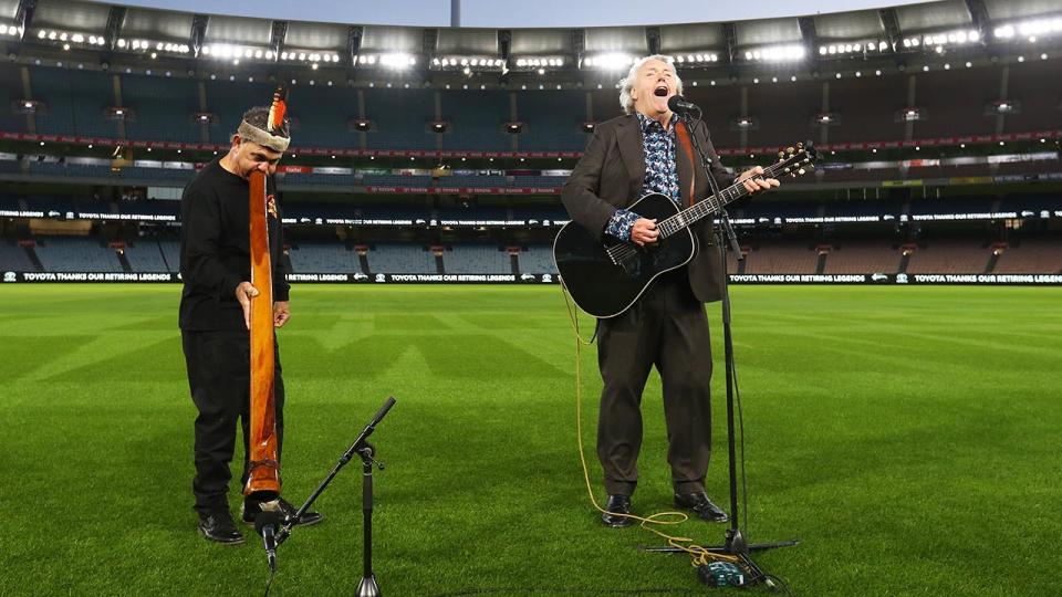 Mike Brady and Ron Murray, pictured here perform as part of the AFL Grand Final entertainment at the MCG..