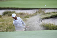 International's Abraham Ancer of Mexico hits out of a bunker during a practice session ahead of the President's Cup Golf tournament in Melbourne, Tuesday, Dec. 10, 2019. (AP Photo/Andy Brownbill)