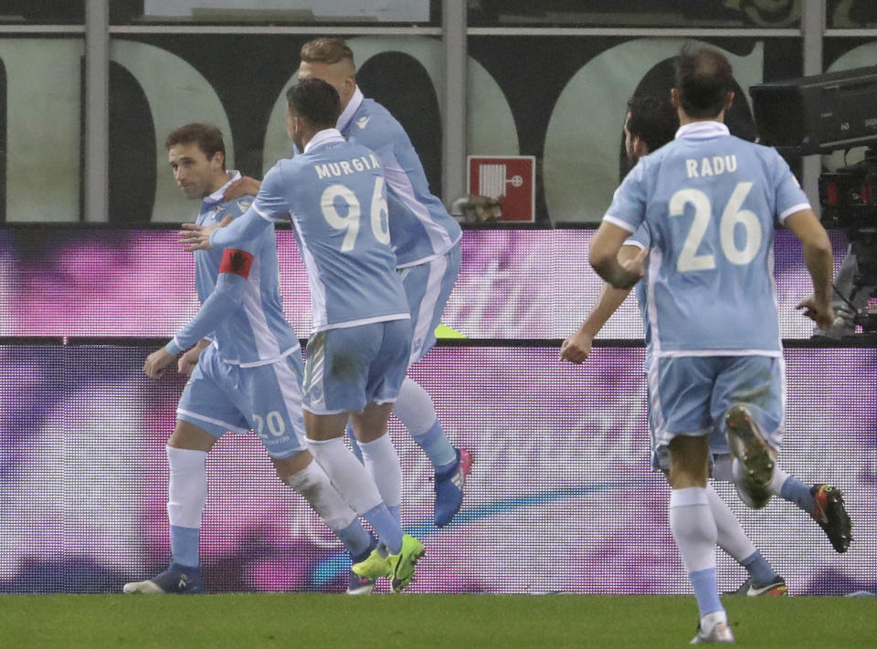 Lazio's Lucas Biglia, left, celebrates after scoring on a penalty kick during an Italian Cup quarterfinal soccer match between Inter Milan and Lazio, at the San Siro stadium in Milan, Italy, Tuesday, Jan. 31, 2017. (AP Photo/Luca Bruno)