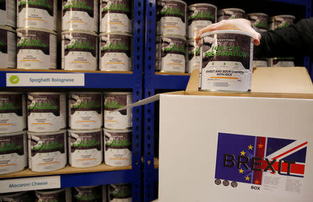 James Blake from emergency food storage.co.uk fills one of the company's 'Brexit Box' kits which contains dehydrated food, water purifying kit and fire starting gel at their warehouse in Leeds, Britain January 21, 2019. REUTERS/Phil Noble