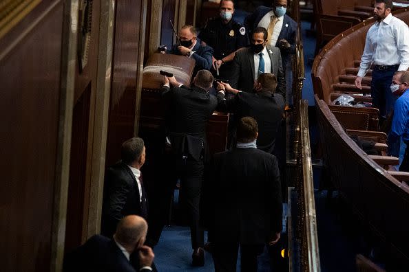 UNITED STATES - JANUARY 6: Security barricades the door of the House chamber as protesters disrupt the joint session of Congress to certify the Electoral College vote on Wednesday, January 6, 2021. (Photo By Tom Williams/CQ-Roll Call, Inc via Getty Images)