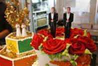 Bride and groom figurines are on display on wedding cakes at Cake and Art bakery in West Hollywood, California June 4, 2008. A California Supreme Court ruling clears the way for gay marriage ceremonies that could bring a business windfall to San Francisco and other cities.