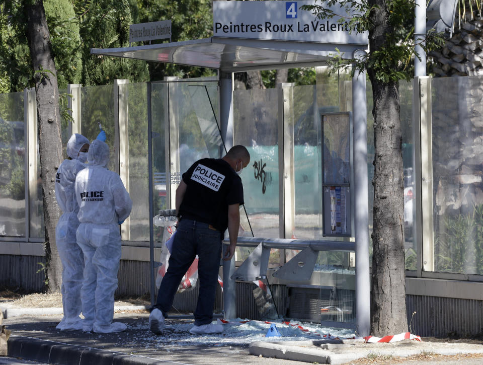 <p>Policce officers inspect a bus stop in La Valentine district after a van rammed into two bus stops in the French port city of Marseille, southern France, Aug.21, 2017. (Photo: Claude Paris/AP) </p>
