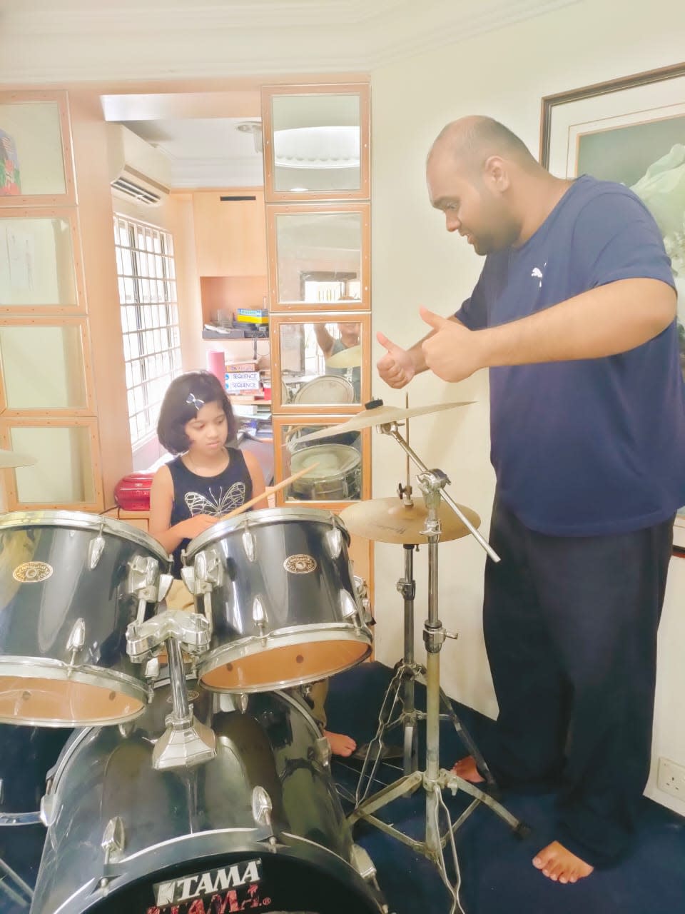 Joshua is now a composer and enjoys teaching music to his students. — Picture courtesy of Sharan Vyner