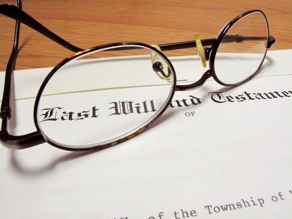 Last will and testament with a pair of eyeglasses sitting on top.