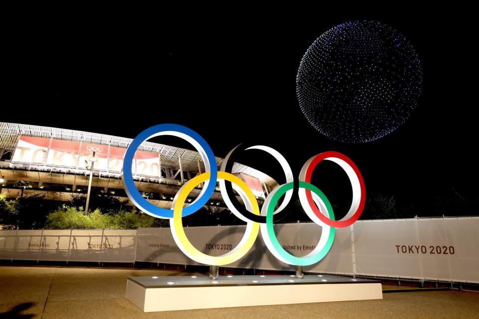 A drone display is seen over the top of the stadium during the opening ceremony.