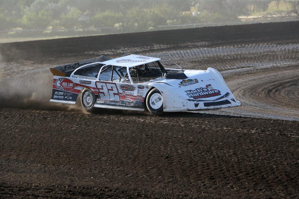 Max Nelson (32) of Milaca, Minn., races during a late model heat at the Dacotah Insurance Rumble Friday at the Brown County Speedway.