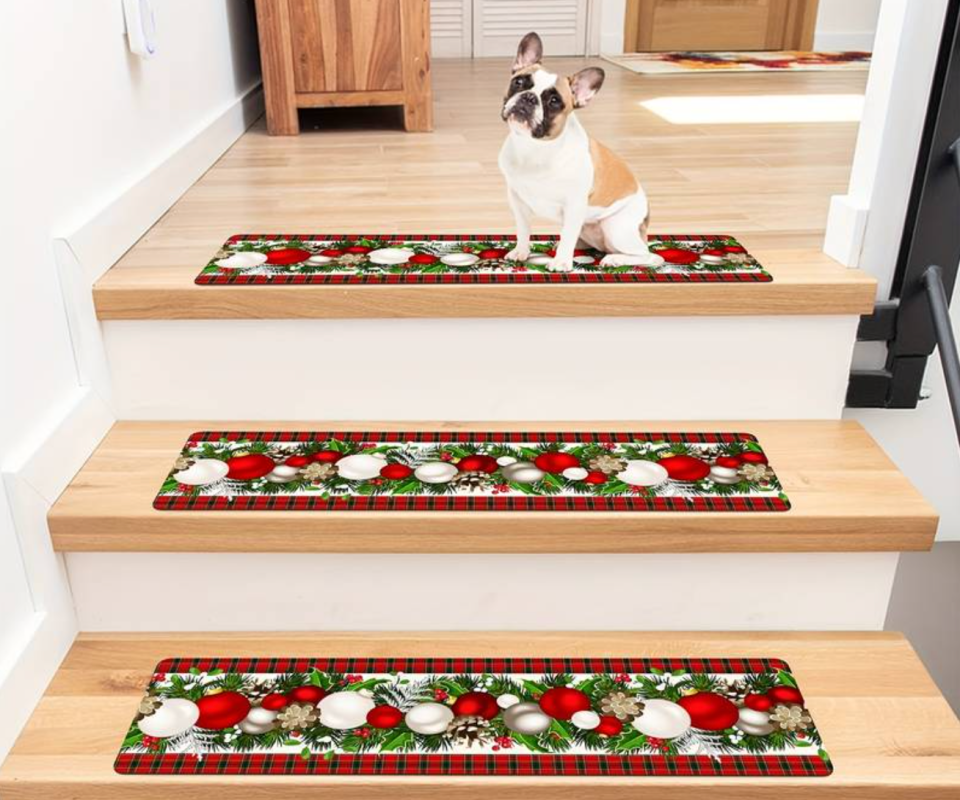 Christmas printed non-stick stair treads with a dog on the top step.