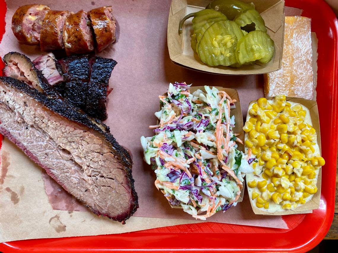 Brisket and sausage with slaw and creamed corn at Terry Black’s Barbecue.