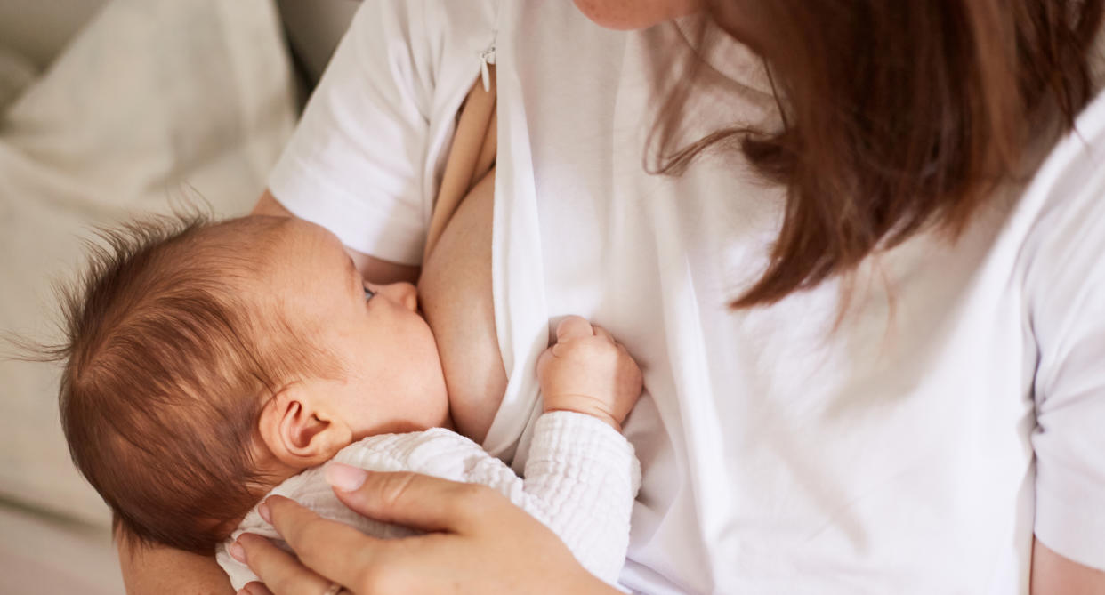 A mother breastfeeding her child