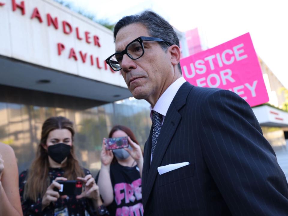 Mathew Rosengart stands among crowd outside the Los Angeles court house.