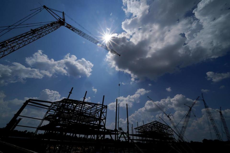 Construction personnel work on what was set to be a state-of-the-art headquarters and practice facility for the Carolina Panthers Tuesday, Aug. 24, 2021, in Rock Hill, S.C. (AP Photo/Chris Carlson)