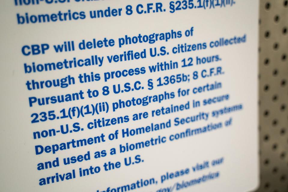 A sign explains the use and purpose of facial recognition biometrics for international travelers entering U.S. Customs and Border Protection at McNamara Terminal at Detroit Metro Airport in Romulus on July 28, 2023.