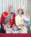 <p>While George stayed close to his dad and Louis in the arms of his mom, their sister opened her arms wide for a big wave. </p>