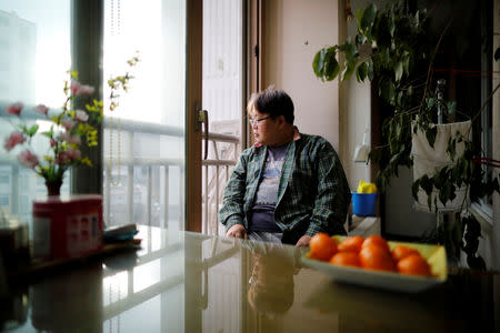 Lee Jae-hwan looks out while sitting on a chair which he used to place his pet dog Kkotgae, at his home in Namyangju, South Korea, January 10, 2019. REUTERS/Kim Hong-Ji