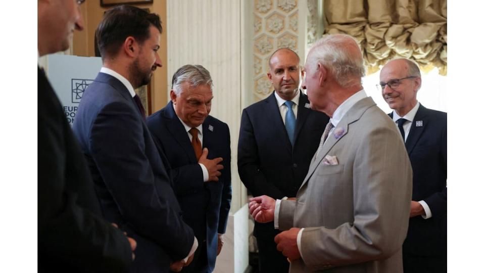 King Charles in a grey suit meeting European leaders including Viktor Orban