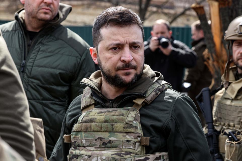 Ukainian President Volodymyr Zelensky stands in the town of Bucha, northwest of the Ukrainian capital Kyiv, on April 4, 2022. - Ukraine's President Volodymyr Zelensky said on April 3, 2022 the Russian leadership was responsible for civilian killings in Bucha, outside Kyiv, where bodies were found lying in the street after the town was retaken by the Ukrainian army. (Photo by RONALDO SCHEMIDT / AFP) (Photo by RONALDO SCHEMIDT/AFP via Getty Images)