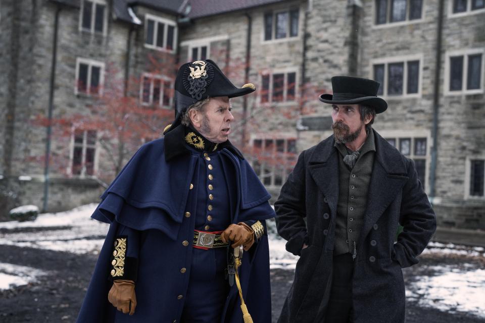 Timothy Spall as Braintree's Sylvanus Thayer and Christian Bale in a scene from "The Pale Blue Eye," a gothic mystery film streaming on Netflix.