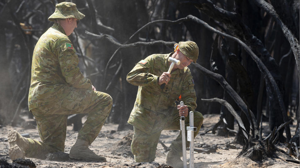 Kynan Lang sets up a memorial for his uncle and cousin on Kangaroo Island.