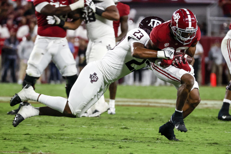 Oct 8, 2022; Tuscaloosa, Alabama; Alabama Crimson Tide tight end Miles Kitselman (88) catches a pass against Texas A&M Aggies linebacker Tarian Lee Jr. (23) during the first half at Bryant-Denny Stadium. Butch Dill-USA TODAY Sports