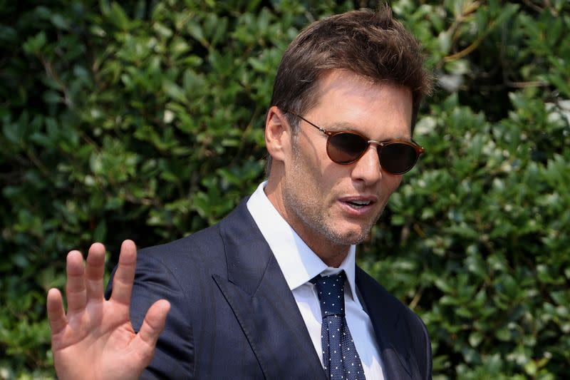 Tamp Bay Buccaneer quarterback Brady gestures during a reception for the team with U.S. President Biden at the White House in Washington