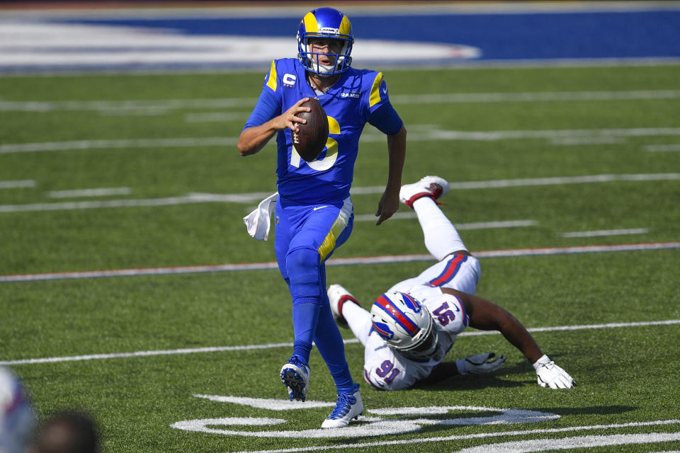 Los Angeles Rams' Jared Goff (16) evades Buffalo Bills' Ed Oliver (91) during the first half of an NFL football game Sunday, Sept. 27, 2020, in Orchard Park, N.Y. (AP Photo/Adrian Kraus)