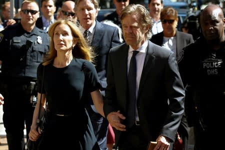 Actress Felicity Huffman and husband William H. Macy arrive at the federal courthouse in Boston