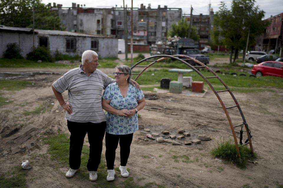 Orlando Urena and Susana Garcia pose for a photo in Cuidad Evita on the outskirts of Buenos Aires, Argentina, Monday, Nov. 13, 2023. García, 62, has lived in Ciudad Evita most of her life. When the campaign started this year, she considered voting for Massa's opponent, right-wing populist Javier Milei. (AP Photo/Natacha Pisarenko)