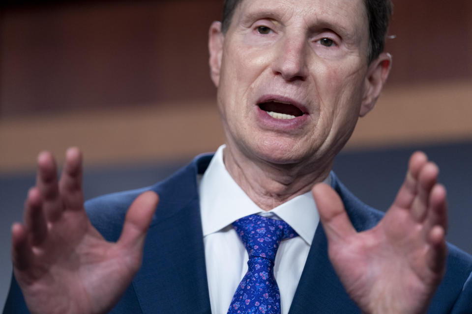 FILE - Sen. Ron Wyden, D-Ore., speaks during a news conference on Capitol Hill in Washington, Sept. 28, 2021. The head of a Senate panel that oversees Medicare is urging the Biden administration to cut back a hefty premium increase that will soon hit enrollees, joining a growing number of Democratic lawmakers demanding action amid widespread concern over rising inflation. (AP Photo/Andrew Harnik, File)