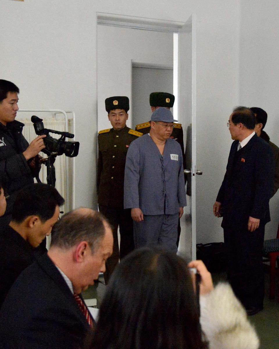 Kenneth Bae (C), a Korean-American Christian missionary who has been detained in North Korea for more than a year, meets a limited number of media outlets in Pyongyang, in this photo taken by Kyodo January 20, 2014. U.S. missionary Kenneth Bae, imprisoned in reclusive North Korea for more than a year, said on Monday he wants to return to his family as soon as possible and hopes the United States will help, Japan's Kyodo news agency reported. (REUTERS/Kyodo)