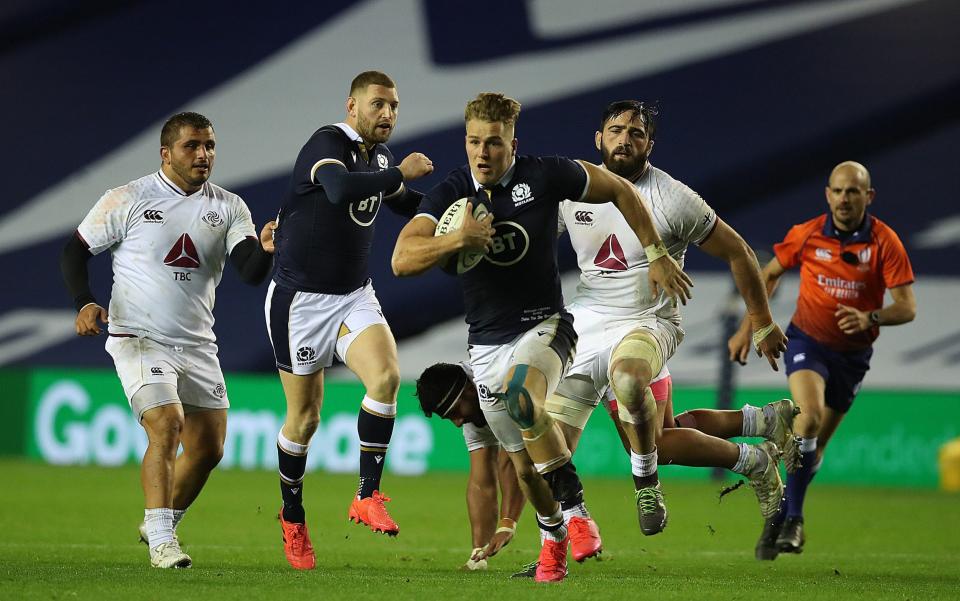 Duhan van der Merwe of Scotland makes a break to score his sides 5th try after being fed a pass from Finn Russell during their side's 45-7 win over Georgia - GETTY IMAGES