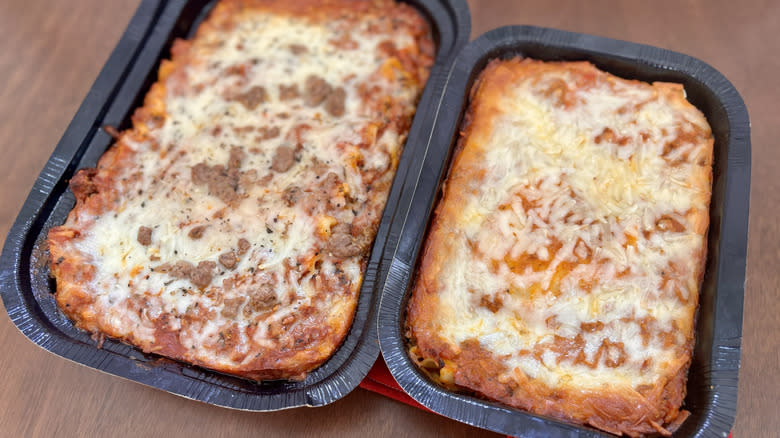 two full lasagnas in black containers