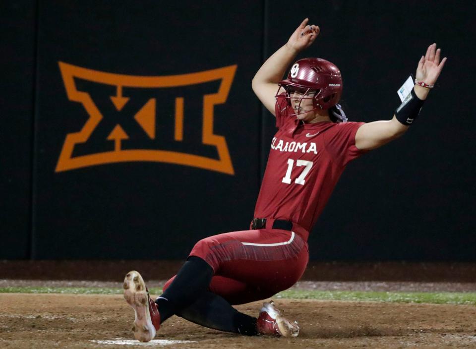 Oklahoma's Sophia Nugent (17) slides home to score a run in the seventh inning of a Bedlam college softball game between the Oklahoma State University Cowgirls (OSU) and the University of Oklahoma Sooners (OU) in Stillwater, Okla., Friday, May 5, 2023. Oklahoma won 8-3.