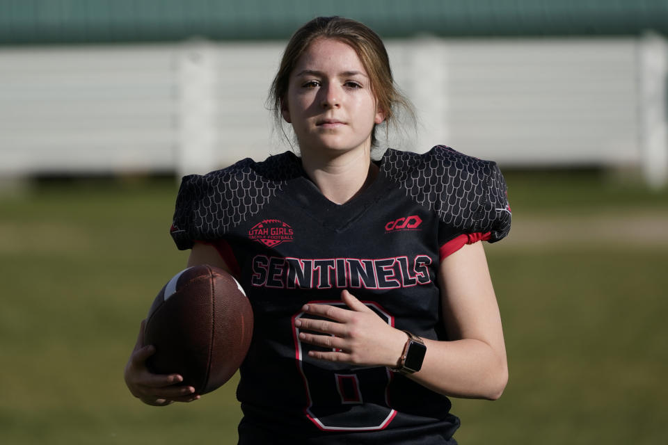 Sam Gordon poses for a photograph, Oct. 20, 2020, in Herriman, Utah. Gordon was the only girl in a tackle football league when she started playing the game at age 9. Now, Gordon hopes she can give girls a chance to play on female-only high school teams through a lawsuit. (AP Photo/Rick Bowmer)
