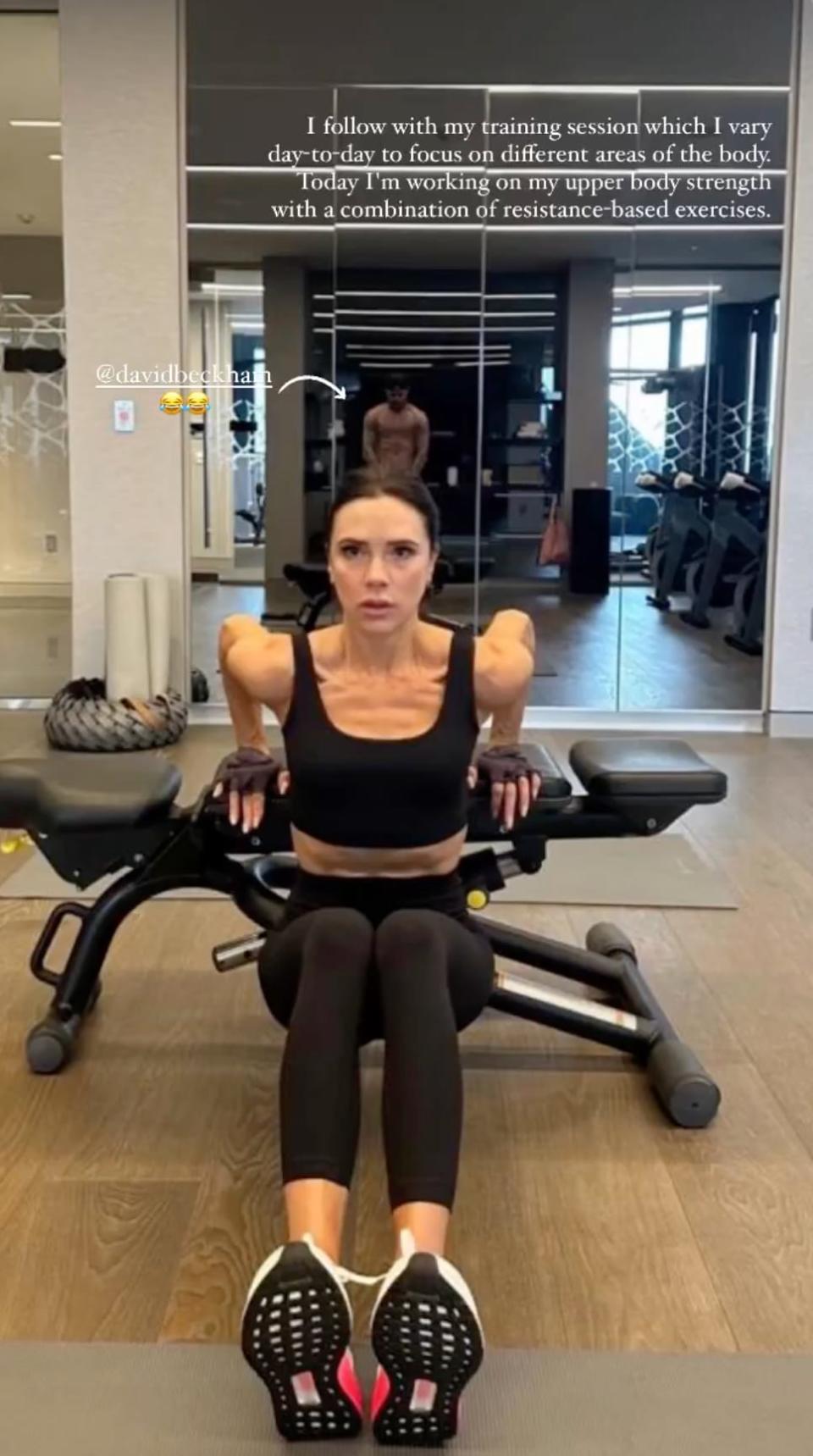 David Beckham featured in the background of Victoria's workout snap