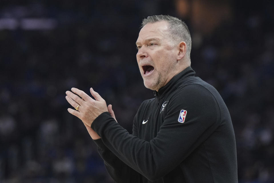 Denver Nuggets head coach Michael Malone gestures from the bench during the first half of an NBA basketball game against the Golden State Warriors, Thursday, Jan. 4, 2024, in San Francisco. (AP Photo/Loren Elliott)