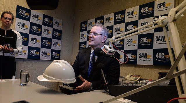 With an inkling of what to expect, Mr Morrison came to the interview armed with a hard hat. Photo: AAP