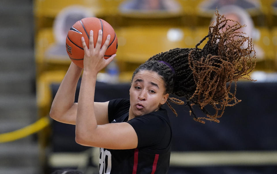 Stanford guard Haley Jones pulls down a rebound against Colorado in the first half of an NCAA college basketball game Sunday, Jan. 17, 2021, in Boulder, Colo. (AP Photo/David Zalubowski)