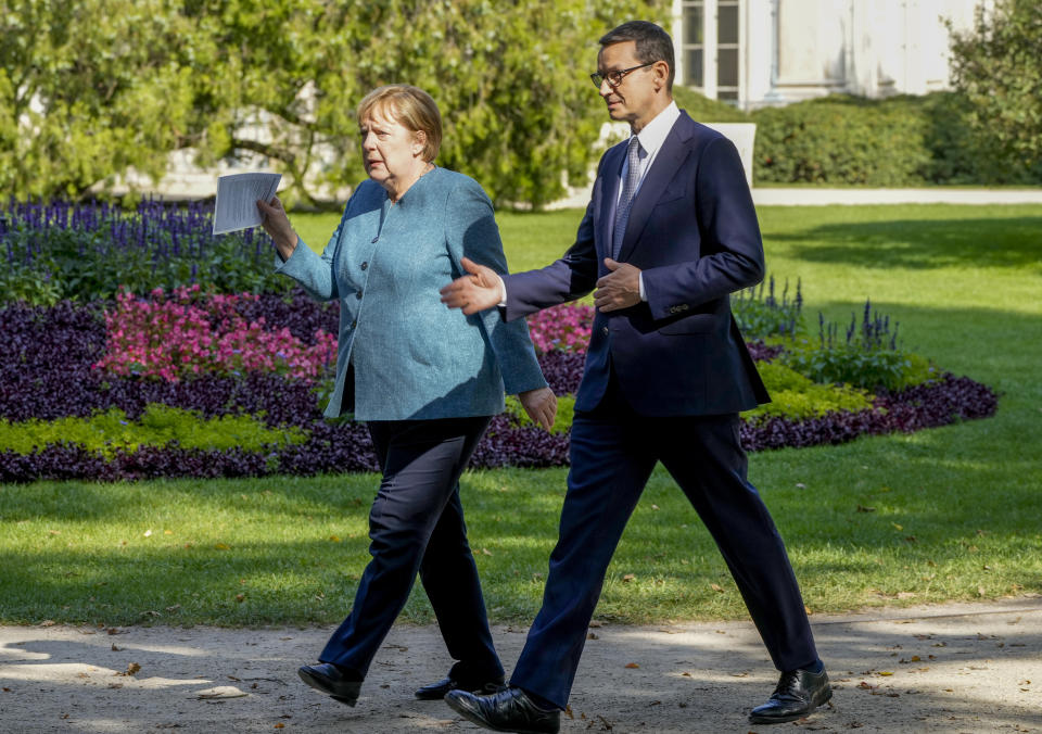 German Chancellor Angela Merkel, left, meets Poland's Prime Minister Mateusz Morawiecki in Warsaw, Poland, Saturday, Sept.11, 2021.Merkel is visiting the Polish capital Morawiecki at a time when Poland faces migration pressure on its eastern border with Belarus. (AP Photo/Czarek Sokolowski)