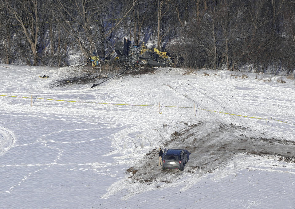 This aerial photo shows the crash site of a Minnesota National Guard Blackhawk helicopter, Friday Dec. 6, 2019, near Kimball, Minn. Three soldiers were killed in Thursday's crash at the edge of a farm field about 30 miles south of St. Cloud. (Brian Peterson/Star Tribune via AP)