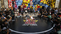 B-boys Jiggz, center, and Flow.T compete during Red Bull BC One event on, Saturday, July 24, 2021. in New York. Many in the breaking community are eager for the art form to expand its audience after the International Olympic Committee announced that it would become an official sport at the Paris 2024 games. But that optimism is hardly unanimous. (AP Photo/Eduardo Munoz Alvarez)