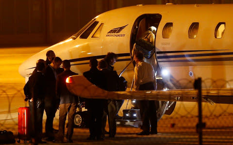 Yucel boards a plan at Ataturk International Airport on Friday night - Credit: Reuters