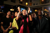 People cheer during a royal wedding watching party for the wedding of Britain's Prince Harry and Meghan Markle at the Cat & Fiddle pub in Hollywood, Los Angeles, California, U.S. May 19, 2018. REUTERS/Lucy Nicholson