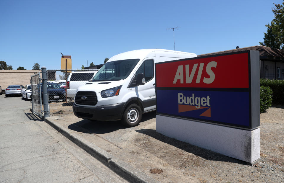 SAN RAFAEL, CALIFORNIA - JULY 28: A sign is posted in front of an Avis Budget rental car office on July 28, 2020 in San Rafael, California. Avis Budget Group reported second quarter earnings with an adjusted net loss of $388 million and a 67 percent decline in revenues compared to one year ago. (Photo by Justin Sullivan/Getty Images)