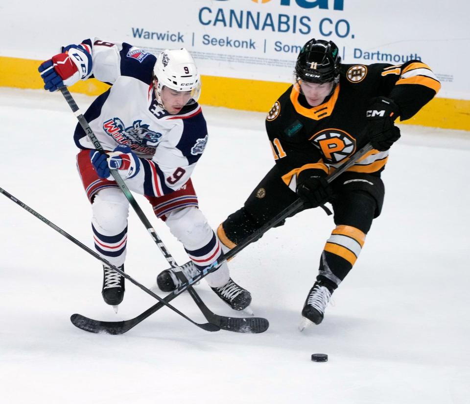 The P-Bruins and Wolfpack chase the puck in Game 1 of the second round of the Calder Cup playoffs on Wednesday at the AMP.